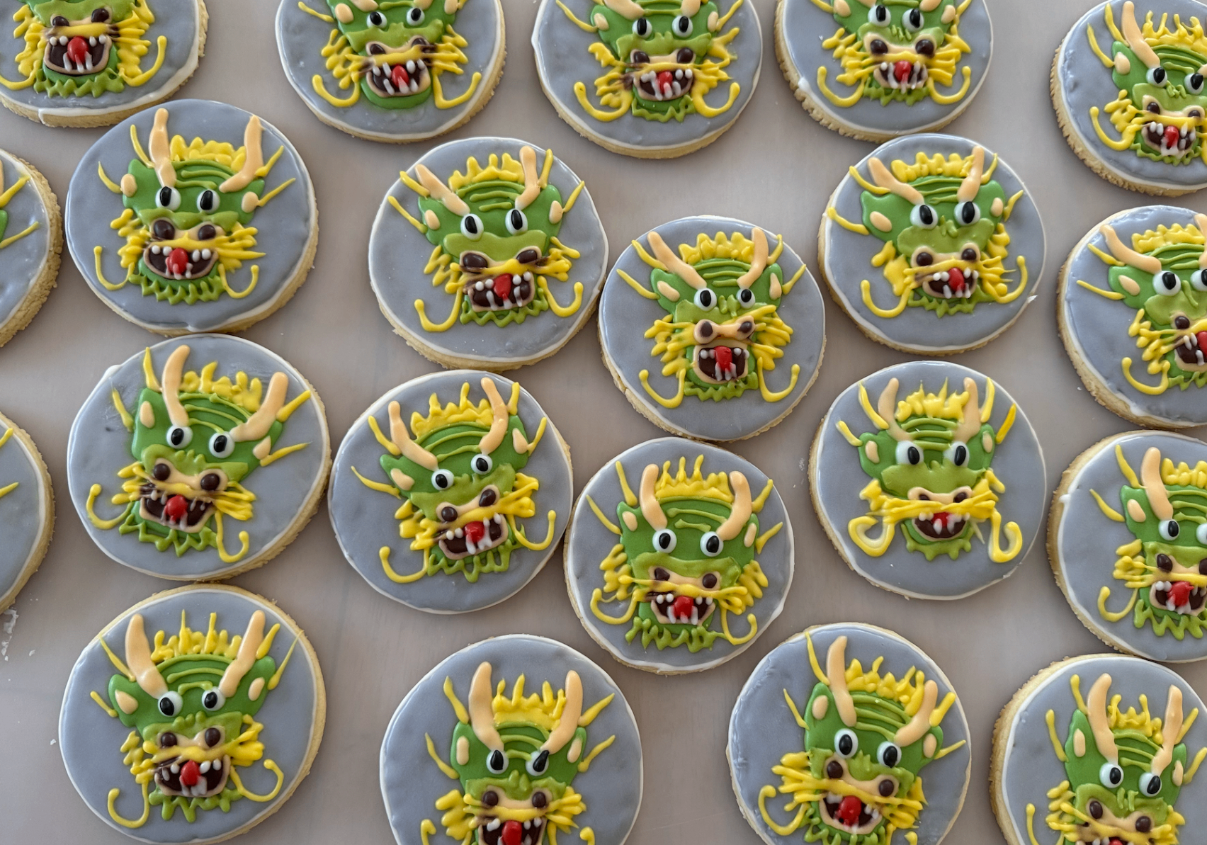 Tray of Lunar New Year dragon cookies with detailed hand-piped designs