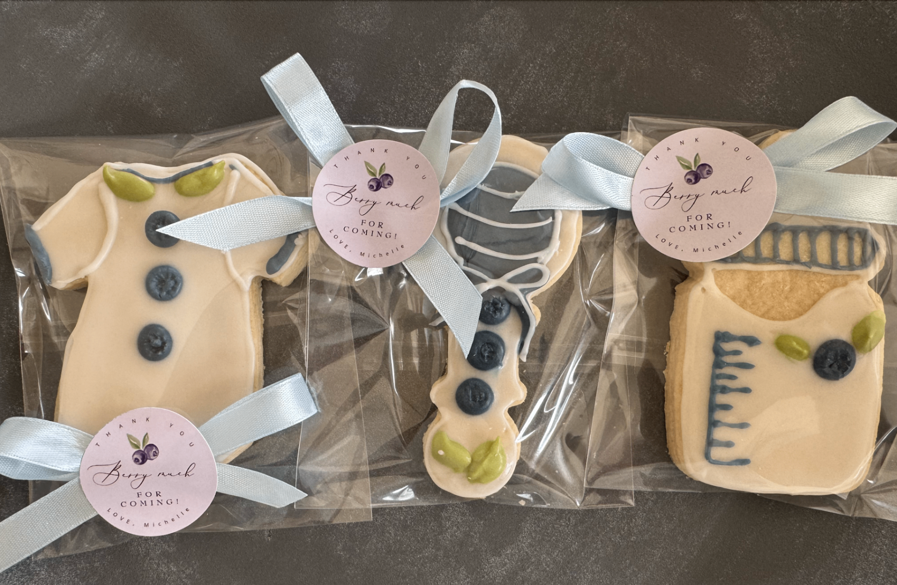 Baby shower cookie set with onesie, rattle, and mason jar
