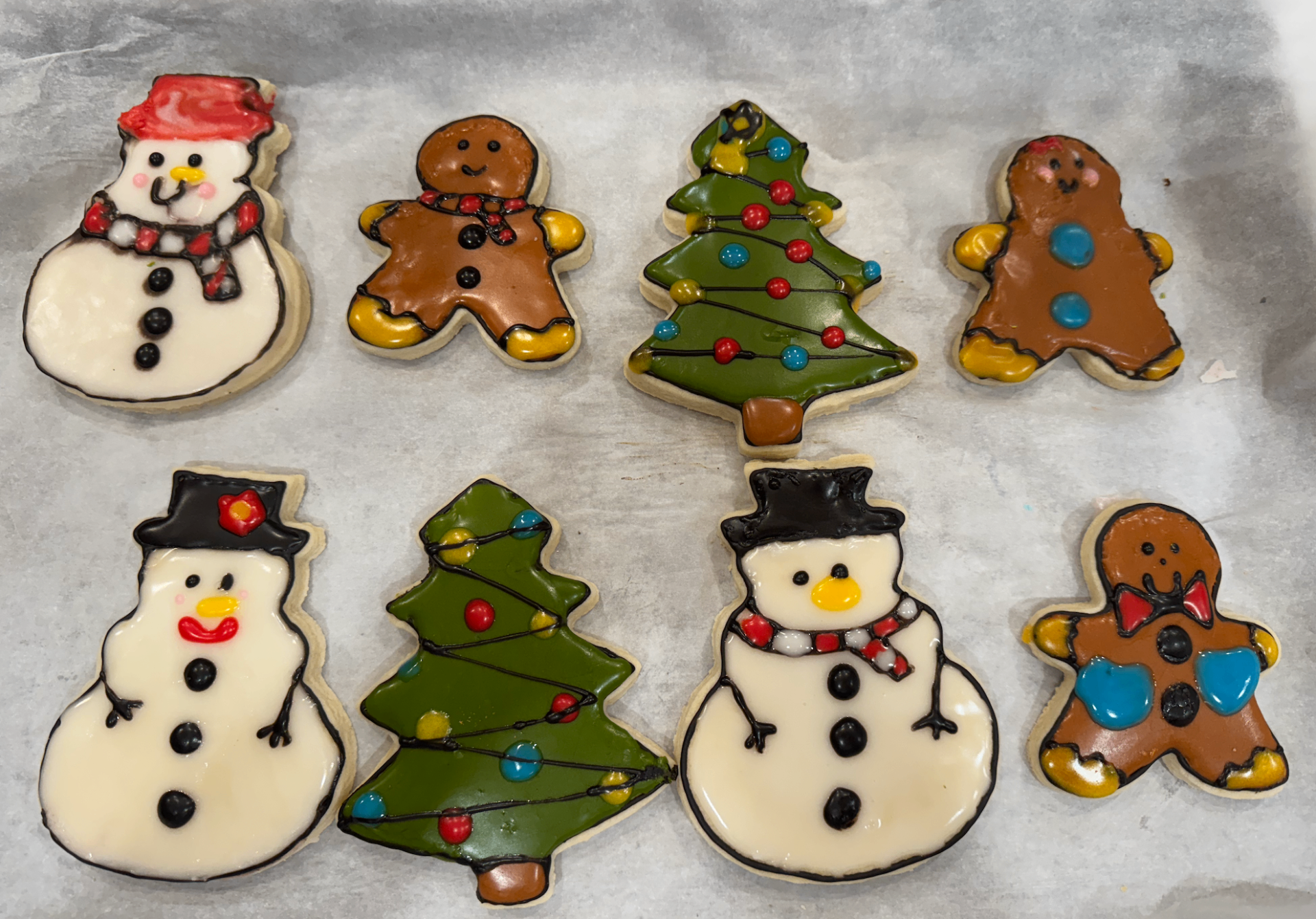 Christmas cookies with snowmen, gingerbread, and Christmas trees
